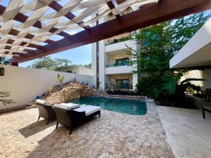 Bazén v ubytování Ha'as Naj Suites Bananas nebo v jeho okolí