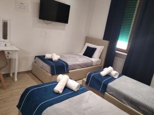 Postel nebo postele na pokoji v ubytování Nuova fiera camera
