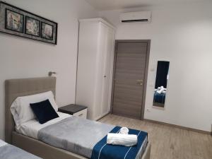Postel nebo postele na pokoji v ubytování Nuova fiera camera