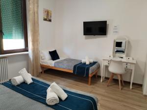 Postel nebo postele na pokoji v ubytování Nuova fiera camera