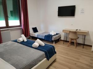 Postel nebo postele na pokoji v ubytování Nuova fiera camera