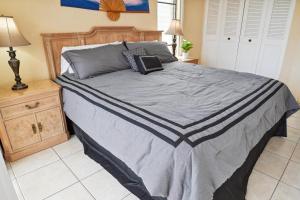 Postel nebo postele na pokoji v ubytování Island Breeze + 9 fotografií