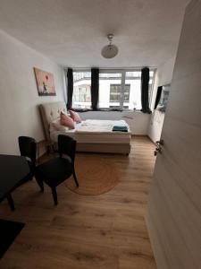Ένα ή περισσότερα κρεβάτια σε δωμάτιο στο Bade Appartements