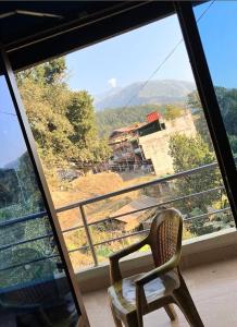 a chair sitting in front of a window at Durbar resort & party place in Wāmitaksār