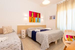 Postel nebo postele na pokoji v ubytování Hotel Villa Rita