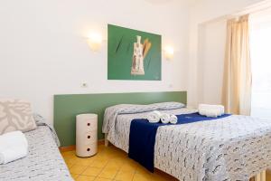 Postel nebo postele na pokoji v ubytování Hotel Villa Rita