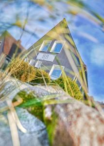 a reflection of a building with windows on it at BETTer Be here in Kellinghusen