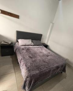 Una cama o camas en una habitación de Hotel Mandarina
