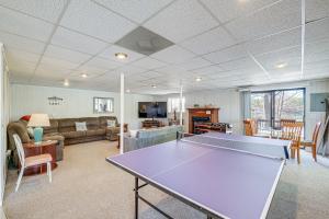 a living room with a ping pong table in it at Smith Mountain Lake House with 2-Story Boat Dock! in Moneta
