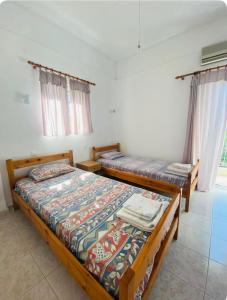 Postel nebo postele na pokoji v ubytování Άρπυια