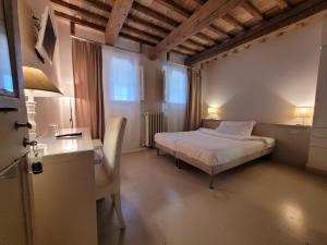 Voodi või voodid majutusasutuse Relais Casetta56 toas