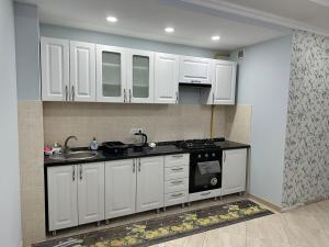 A cozinha ou cozinha compacta de Fine Sleep & Fly mais 1 foto