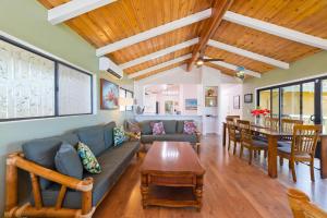 a living room with a couch and a table at Pu'u Nui in Waikoloa Village