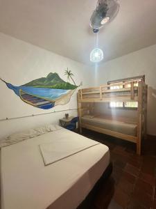 a bedroom with a bed and a bunk bed at El Sofá Caracas in Caracas