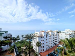 a view of the ocean from a building at Beautiful first line Penthouse with Sea View Mi Capricho in Mijas Costa