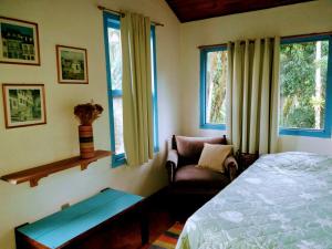 Cama ou camas em um quarto em Pousada Arboretum