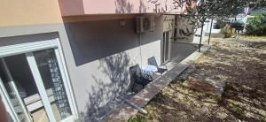 a chair sitting in a yard next to a house at Fazana SS in Fažana