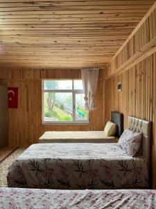 Postel nebo postele na pokoji v ubytování DORUK Pansiyon + 20 fotografií