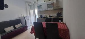 a living room with a table and a couch at Fazana SS in Fažana +15 photos