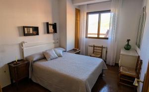 Giường trong phòng chung tại Apartamento El Parral
