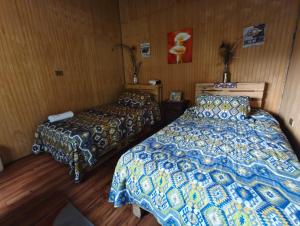 Postel nebo postele na pokoji v ubytování Petrohue hospedaje Dónde la Nena