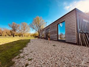 a house with a large window on the side of it at Casterton stays in Tickencote