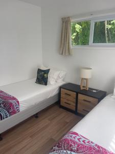 Postel nebo postele na pokoji v ubytování Palm Tree Villas