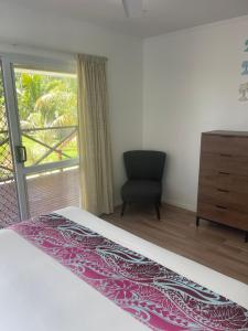 Postel nebo postele na pokoji v ubytování Palm Tree Villas