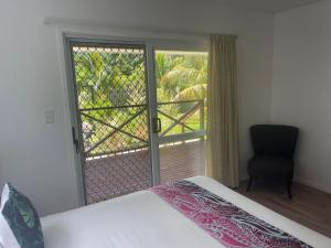 Postel nebo postele na pokoji v ubytování Palm Tree Villas