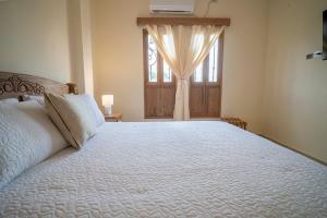 Voodi või voodid majutusasutuse Balcones de Jaen toas