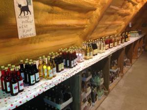a row of bottles of wine on display in a store at Gripenbergs Gårdsbutik in Skänninge