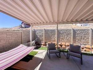 a patio with two chairs and a hammock at Bear Lake Escape-Pet Friendly in Garden City