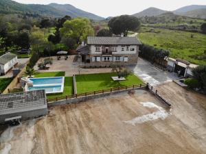 an aerial view of a house in a flooded yard at Finca Avellaneda in Navahondilla