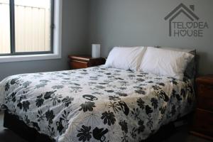 Ένα ή περισσότερα κρεβάτια σε δωμάτιο στο Telopea House