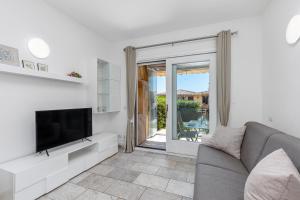 TV a/nebo společenská místnost v ubytování Casa Vacanze Lo Squalo