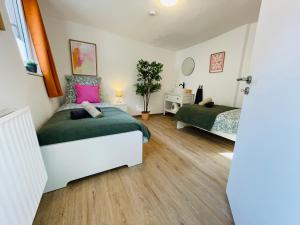 Katil atau katil-katil dalam bilik di Ferienhaus Müdenzauber