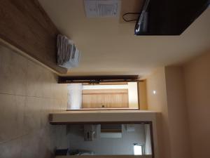 a small bathroom with a sink and a mirror at Hotel TORTUGA REAL in Santa Cruz Huatulco