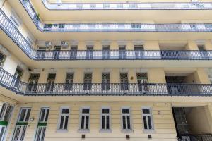 a building with a balcony with blue rails at Buda or Pest in Budapest +5 photos