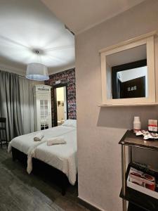 Postel nebo postele na pokoji v ubytování B&B Notti d'Oriente