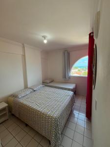 Ένα ή περισσότερα κρεβάτια σε δωμάτιο στο Apartamento em São José