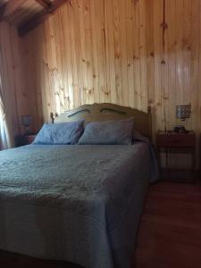 Postel nebo postele na pokoji v ubytování Cabañas Tía Marce, Los Lleuques