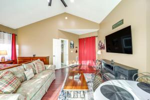 a living room with a couch and a tv at 3 Mi Beech Mtn Resort: Cozy Studio w/ Deck & View! in Beech Mountain