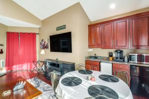 a kitchen with a white table in a room at 3 Mi Beech Mtn Resort: Cozy Studio w/ Deck & View! in Beech Mountain