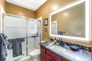 a bathroom with a shower and a sink and a mirror at 3 Mi Beech Mtn Resort: Cozy Studio w/ Deck & View! in Beech Mountain +17 photos