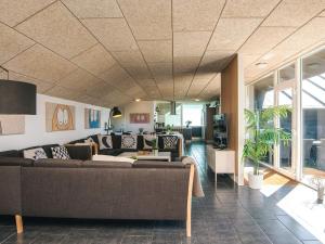 a living room with a couch and a table at Luxury Retreat in Vorupor - By Traum Ferienwohnungen in Snedsted