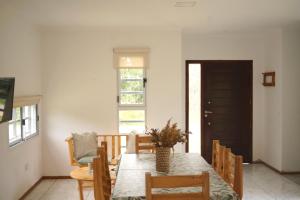 a dining room with a table and chairs at Casa de campo Ranchos in Ranchos