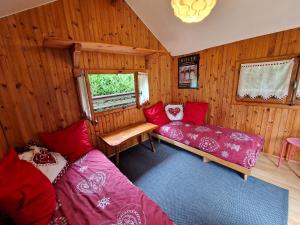 a room with two beds in a wooden room at Evian villa with Lake Geneva views in 1960 mid-century modern style in Neuvecelle