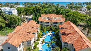 an aerial view of a resort with a pool at Pro Cab Paradise Condos Cabarete in Cabarete
