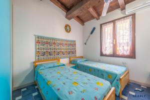 Postel nebo postele na pokoji v ubytování Villetta Teodorina - By Searly