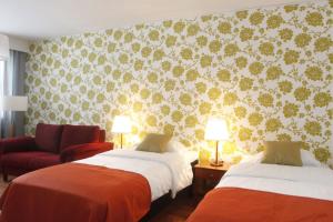 Кровать или кровати в номере Hotelli Pogostan Hovi